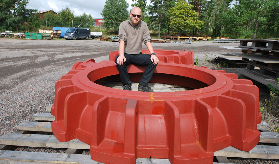Production Manager Henrik Tilljander sits on a component that was processed in the machine shop.