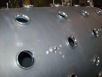 The customer will be welding Inconel tubes at each hole, so the shoulders must have a tight wall thickness tolerance of ±0.003", and consistent land and welding bevels, so there are no thick and thin areas. For consistency from hole to hole, and from part to part, the NC programming and machining have to be precise.
