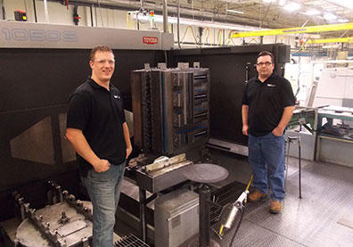 Kevin Hjelmgren (left) and Gary Warlow wrote programs using GibbsCAM macros to automate processes at Wilson Tool’s bending division to make parts as needed in “lots of one.”