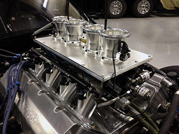 New Switzer Dynamics intake manifold made for Reher-Morrison Racing Engines qualified with a first place at its debut at Bristol in April 2013. Previously fabricated from sheetmetal, it’s now made with components machined from aluminum billet and programmed with GibbsCAM.