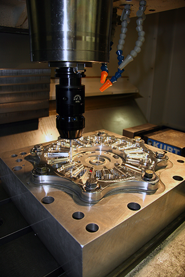 A Renishaw probe doing a probing cycle as a final check for proper clutch lever clearance and lever-pin depth in all the pockets.