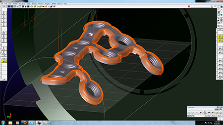 Geometric complexity of orthopedic plates doesn’t allow working from a datum and requires five-axis machining. Part features lie on different planes, at various angles from part axis as shown in GibbsCAM rendering.