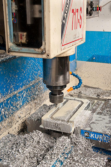 Pleas completely relies on GibbsCAM in programming his restored Lagun CNC, shown here machining two brackets from aluminum billet. The table provides space for two vises when machining the longer billets for the tripod head.